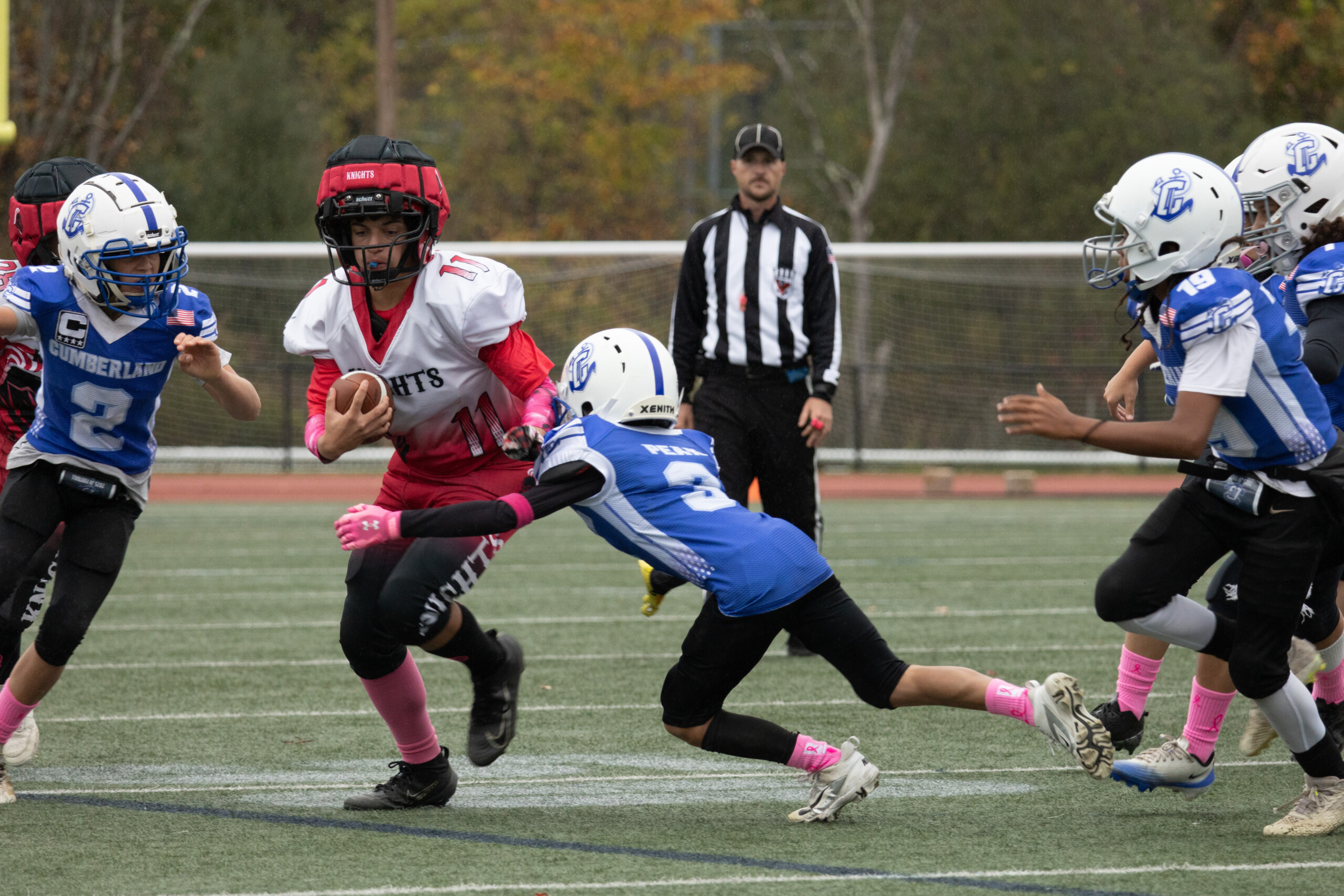 football player tackles running back