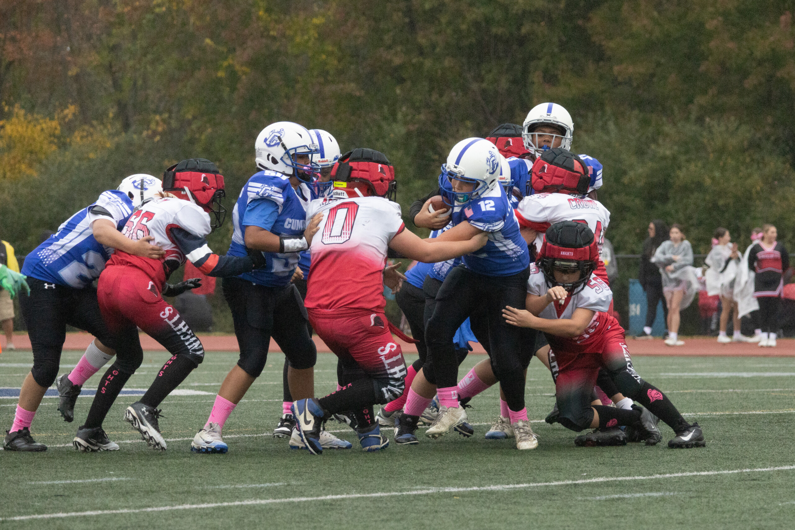 football player breaks a tackle